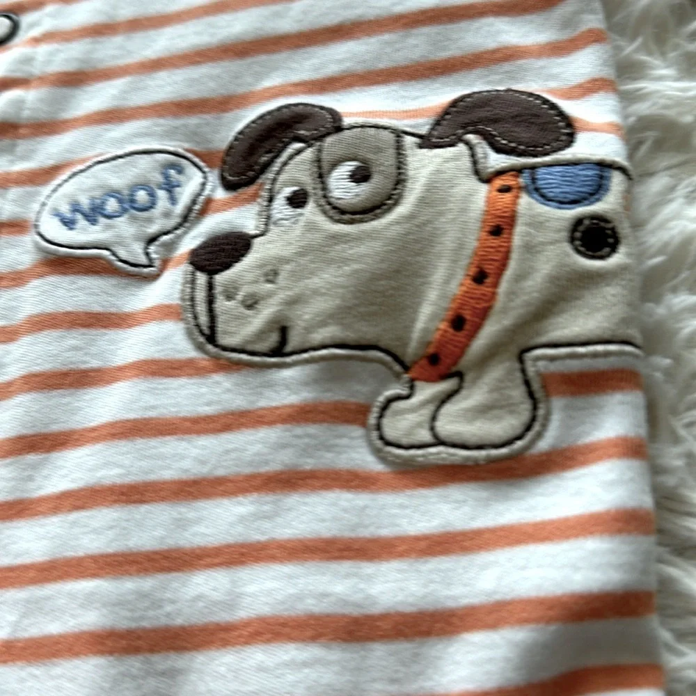 Cute as a button onesie with doggie print